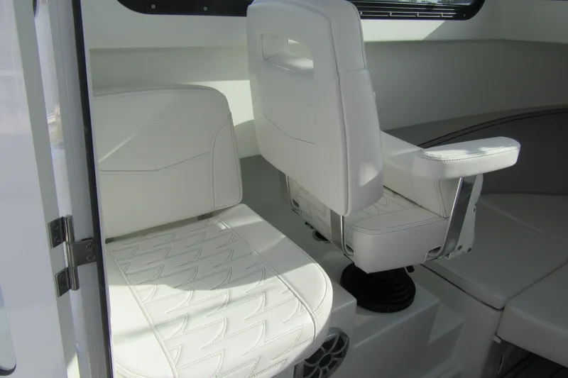 Slide: The Image of 2026 Parker 227 Explorer Sport Cabin interior with white seating and modern design. - 16