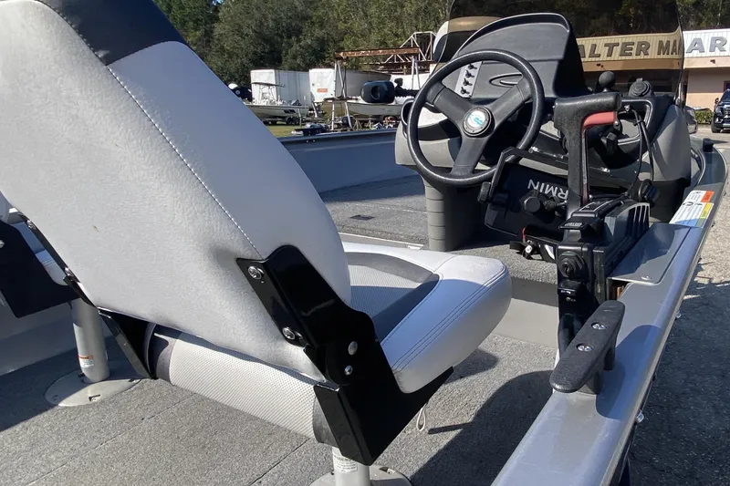 Slide: The Image of 2013 Crestliner 16 SC boat interior with steering wheel and seat. - 6