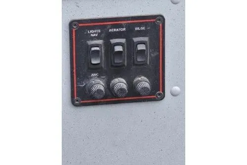 Slide: The Image of Control panel of 2012 Lund 1600 Fury Tiller boat with switches for lights, aerator, and bilge. - 5