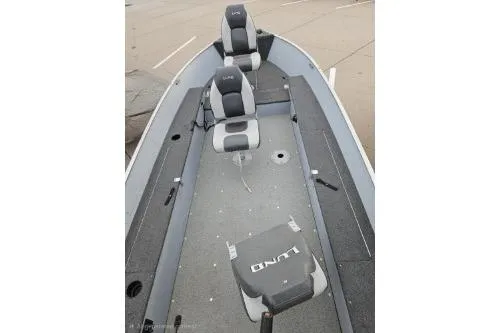 Slide: The Image of 2012 Lund 1600 Fury Tiller boat interior with seating and storage compartments. - 6