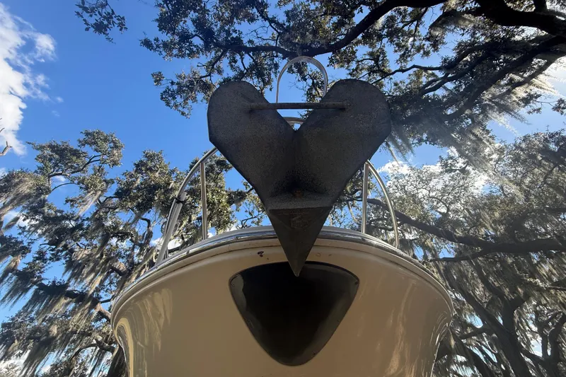 Slide: The Image of 2004 Monterey 265 Cruiser interior with kitchenette, microwave, sink, and seating area. - 20