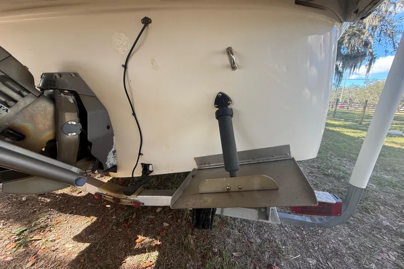 Slide: The Image of 2004 Monterey 265 Cruiser cabin interior with beige walls and carpet flooring. - 22