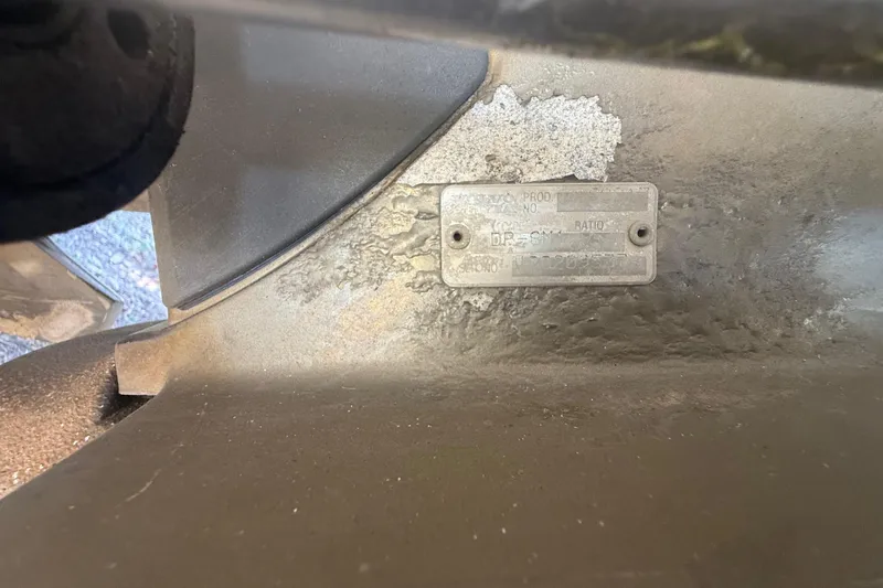 Slide: The Image of 2004 Monterey 265 Cruiser interior with wooden door and seating area. - 27