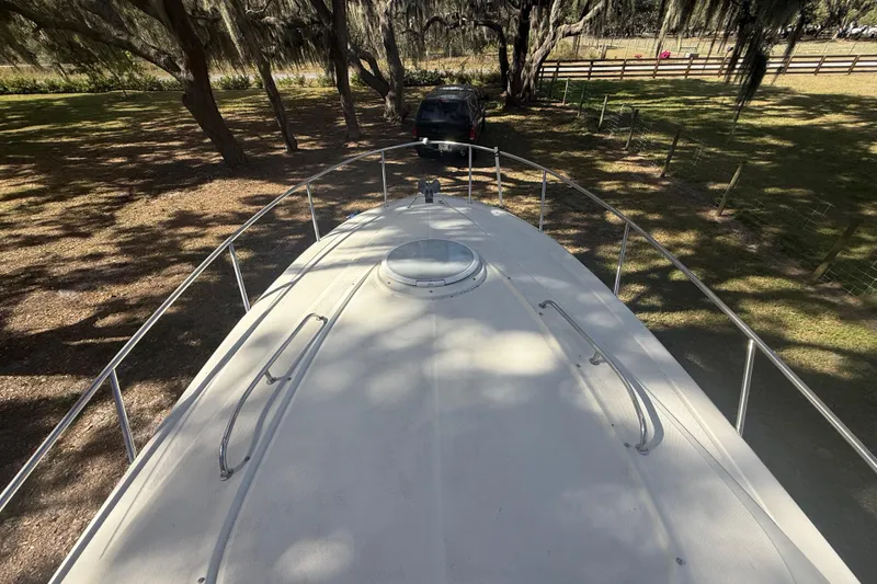 Slide: The Image of 2004 Monterey 265 Cruiser boat deck view with railing and hatch. - 36