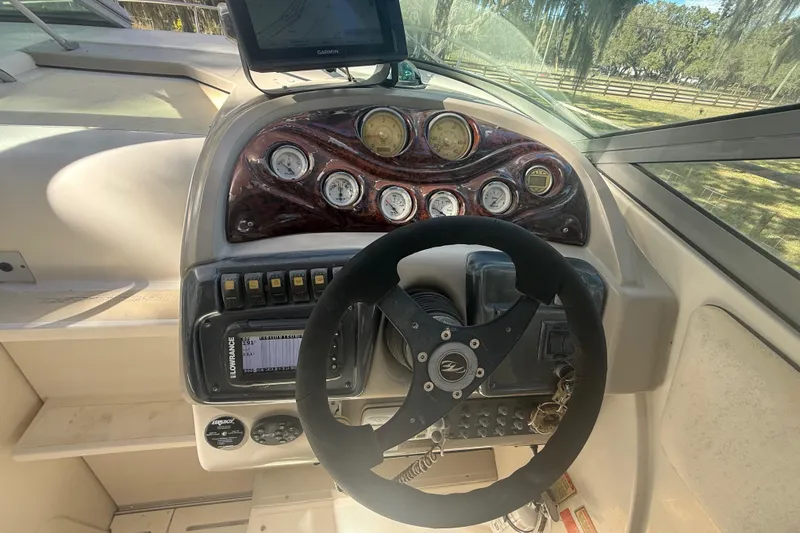 Slide: The Image of 2004 Monterey 265 Cruiser boat deck with railing and hatch, viewed from above. - 40
