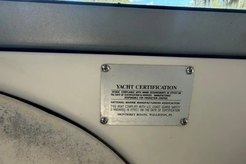 Slide: The Image of Engine compartment of a 2004 Monterey 265 Cruiser boat, showcasing mechanical components. - 51