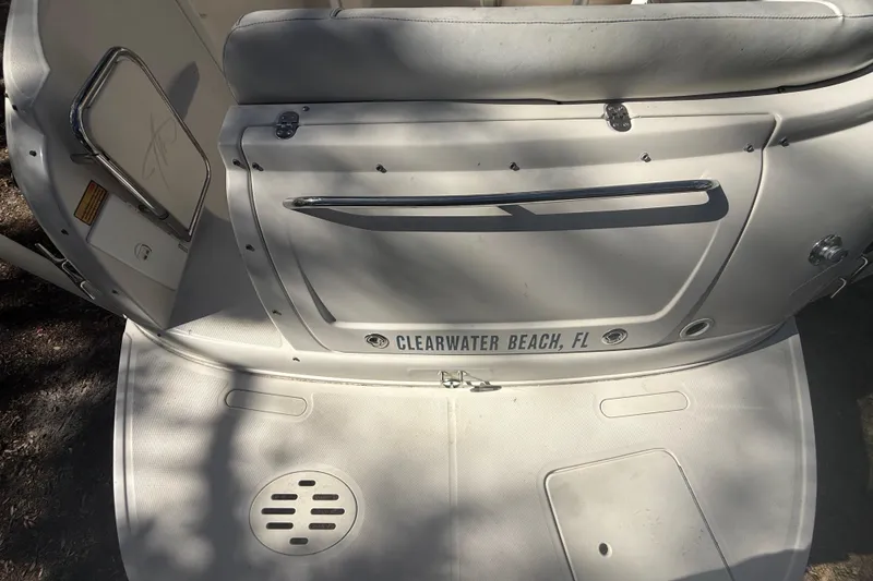 Slide: The Image of Control panel of a 2004 Monterey 265 Cruiser boat with switches and dials. - 52