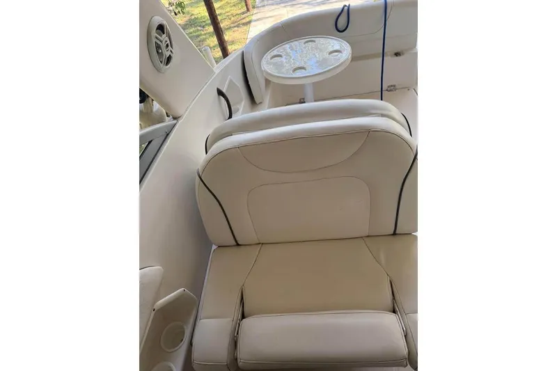 Slide: The Image of 2004 Monterey 265 Cruiser boat on trailer, sunlit background. - 6