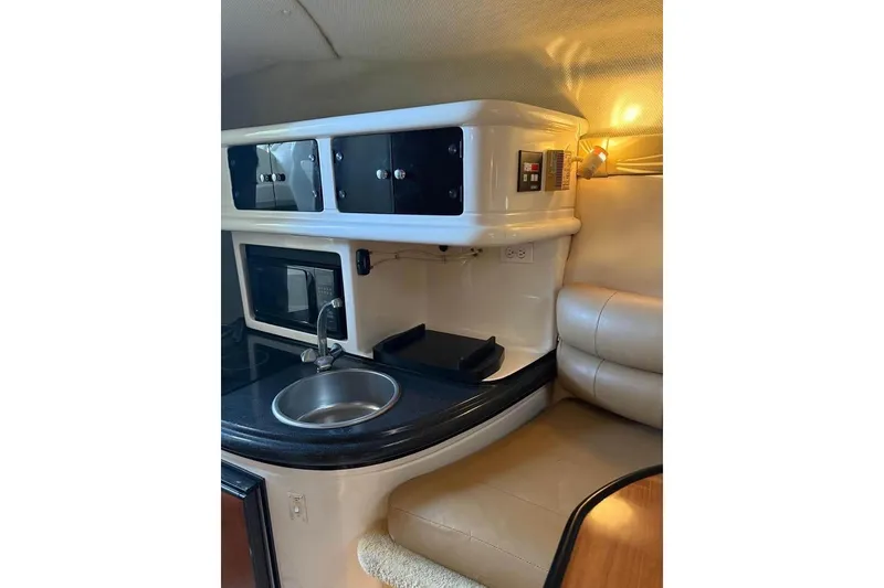 Slide: The Image of 2004 Monterey 265 Cruiser boat on trailer under clear blue sky. - 7