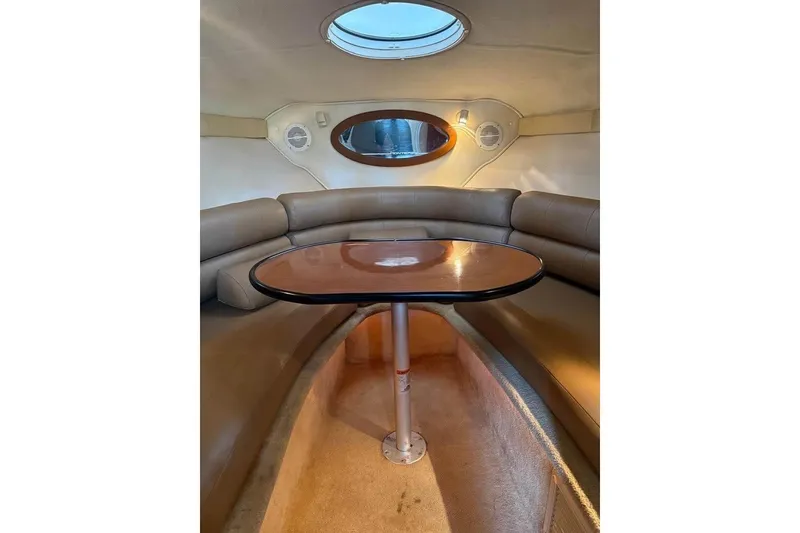 Slide: The Image of 2004 Monterey 265 Cruiser boat displayed outdoors under clear blue sky. - 8