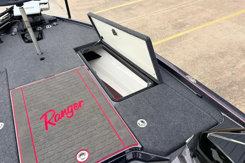 Slide: The Image of 2025 Ranger Z521R Cup-Equipped boat deck with open storage compartment. - 21