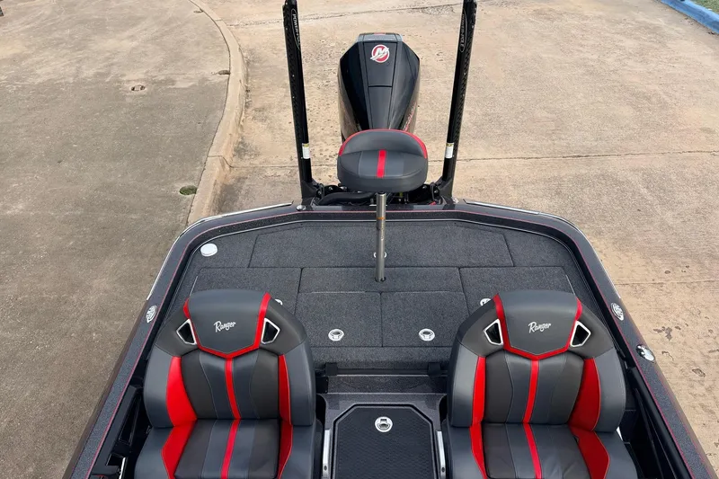 Slide: The Image of 2025 Ranger Z521R Cup-Equipped boat interior with red and black seats. - 28