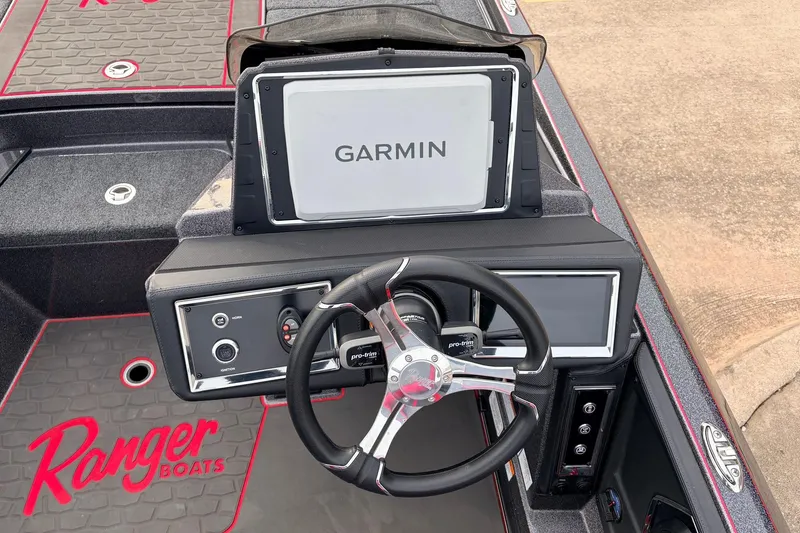 Slide: The Image of 2025 Ranger Z521R Cup-Equipped boat dashboard with Garmin navigation system and steering wheel. - 37