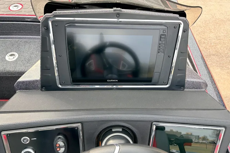 Slide: The Image of 2025 Ranger Z521R Cup-Equipped boat dashboard with Garmin display and controls. - 38
