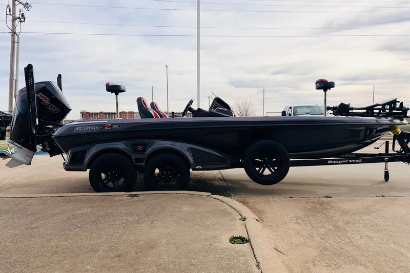 Slide: The Image of 2025 Ranger Z521R Cup-Equipped boat on trailer, side view, parked outdoors. - 4