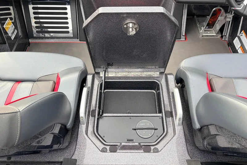 Slide: The Image of 2025 Ranger Z521R Cup-Equipped boat interior with open storage compartment between seats. - 43