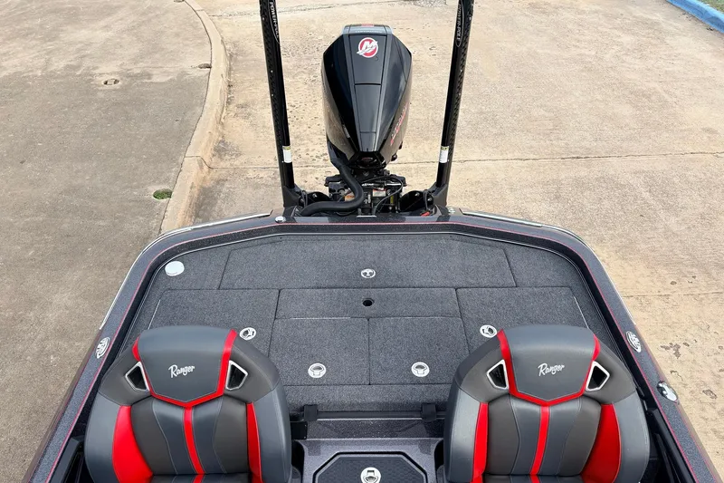 Slide: The Image of 2025 Ranger Z521R Cup-Equipped boat interior with dual seats and motor view. - 44