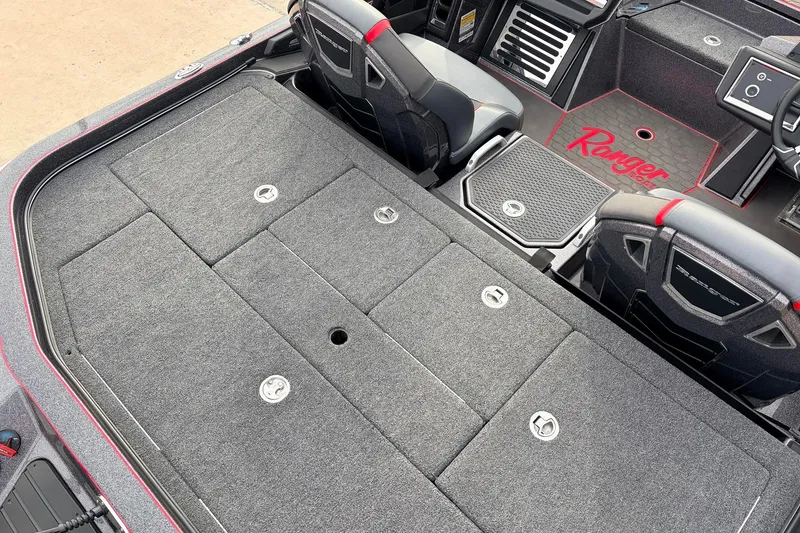 Slide: The Image of 2025 Ranger Z521R Cup-Equipped boat interior with carpeted storage and seating. - 45