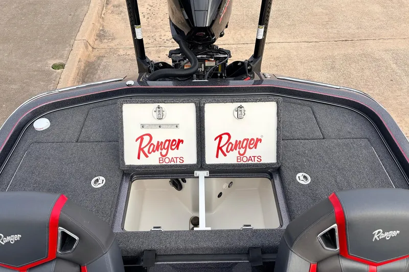 Slide: The Image of 2025 Ranger Z521R Cup-Equipped boat interior with storage compartments and branded seats. - 47