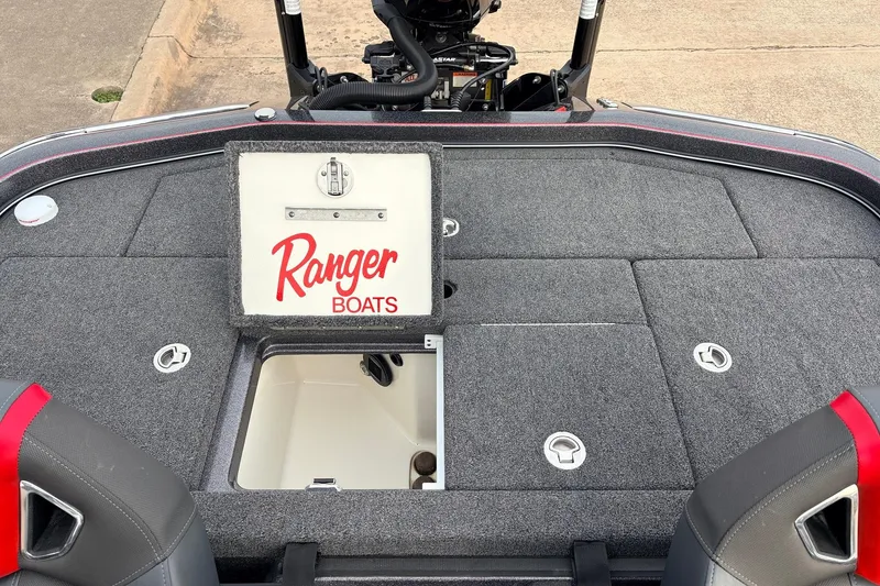 Slide: The Image of 2025 Ranger Z521R Cup-Equipped boat deck with storage compartment open. - 48