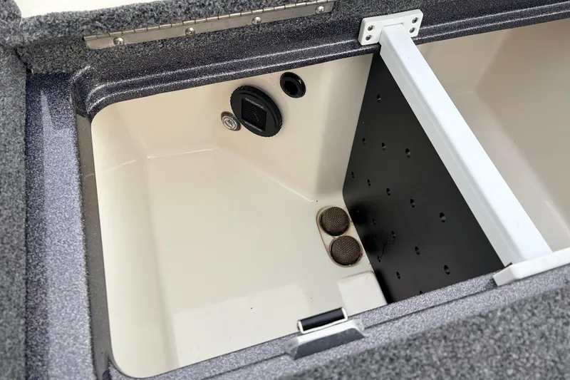 Slide: The Image of 2025 Ranger Z521R Cup-Equipped boat storage compartment with drainage and ventilation features. - 49