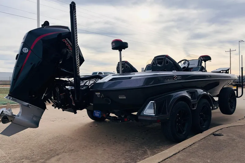 Slide: The Image of 2025 Ranger Z521R Cup-Equipped boat on trailer, rear view, overcast sky. - 5