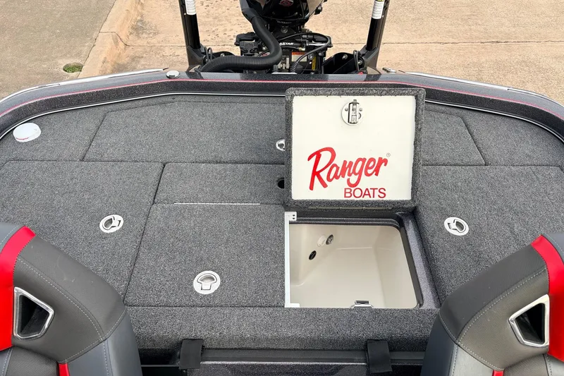 Slide: The Image of 2025 Ranger Z521R Cup-Equipped boat interior with storage compartments and logo. - 50