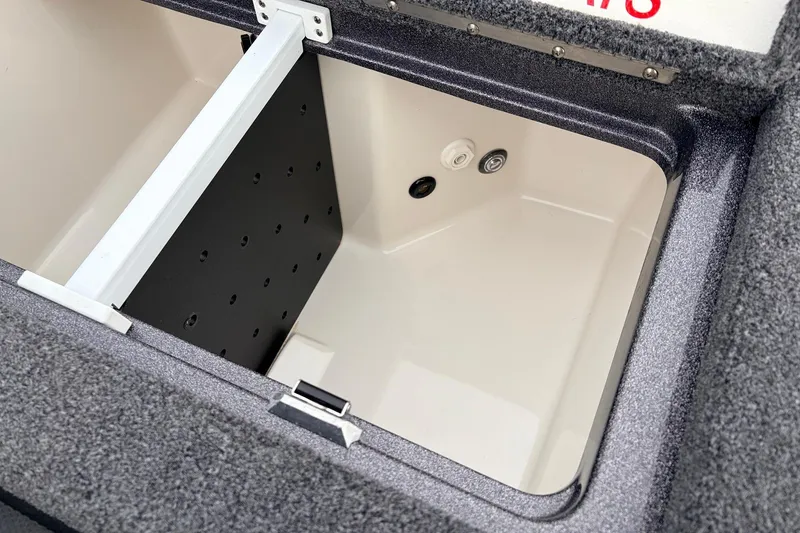 Slide: The Image of 2025 Ranger Z521R Cup-Equipped boat storage compartment with divider and drainage system. - 51