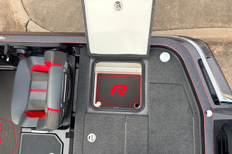Slide: The Image of 2025 Ranger Z521R Cup-Equipped boat interior with open storage compartment and seating. - 53