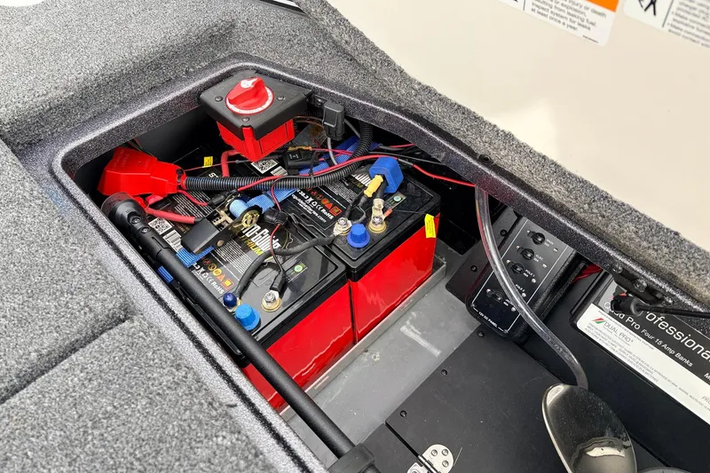 Slide: The Image of 2025 Ranger Z521R Cup-Equipped boat battery compartment with wiring and components. - 55