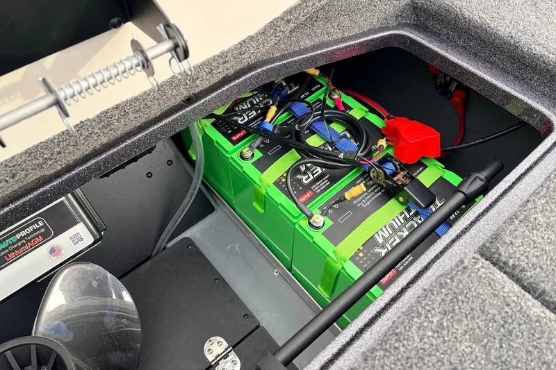 Slide: The Image of 2025 Ranger Z521R Cup-Equipped boat battery compartment with lithium batteries and wiring. - 57