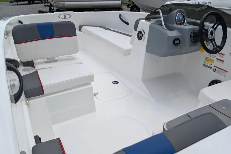 Slide: The Image of 2022 Tahoe T16 boat interior with modern seating and steering console. - 4