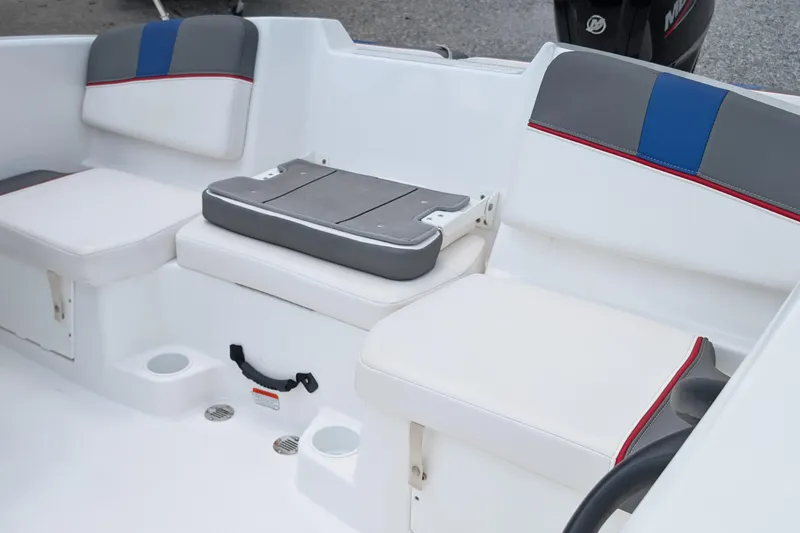 Slide: The Image of 2022 Tahoe T16 boat interior with cushioned seating and cup holders. - 5