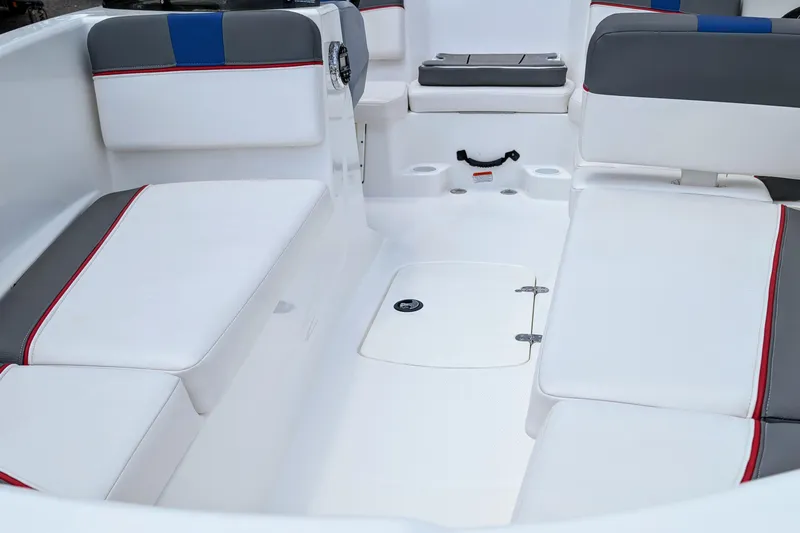 Slide: The Image of 2022 Tahoe T16 boat interior with white and gray seating, red accents. - 6