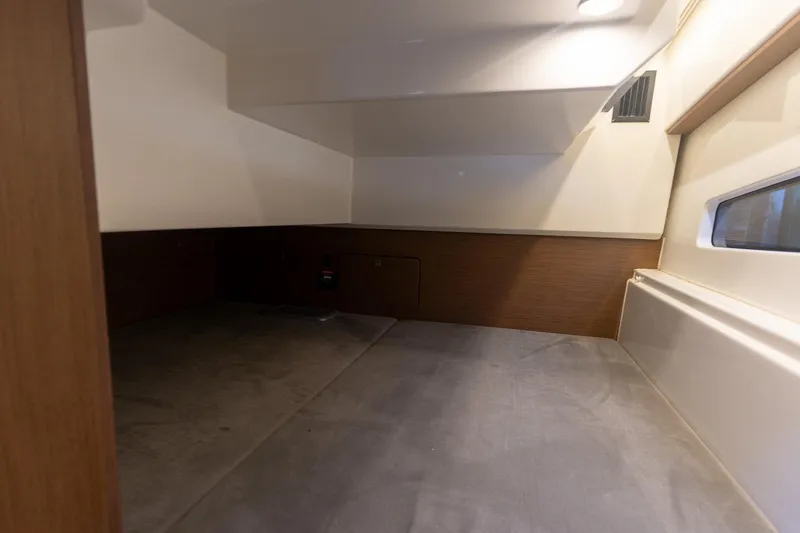 Slide: The Image of Interior cabin of 2021 Beneteau Antares 9 boat, featuring modern design and cozy space. - 15