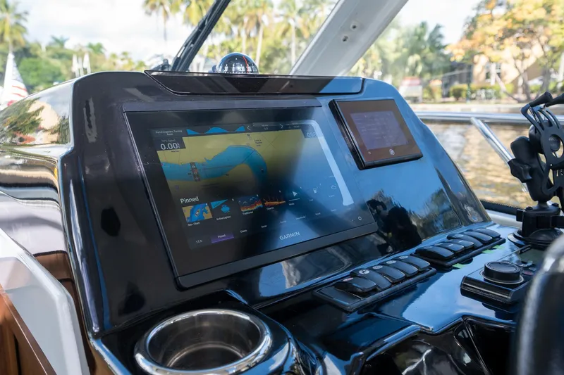 Slide: The Image of Dashboard of 2021 Beneteau Antares 9 with navigation display and controls. - 24