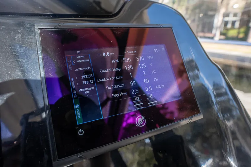 Slide: The Image of Dashboard display of a 2021 Beneteau Antares 9 showing engine metrics and maintenance data. - 35