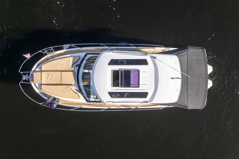 Slide: The Image of Overhead view of 2021 Beneteau Antares 9 boat on dark water. - 4