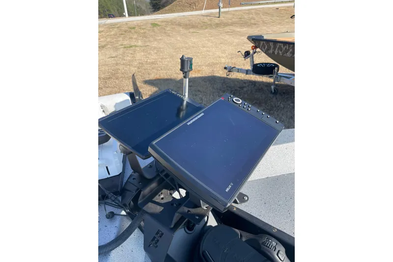 Slide: The Image of 2024 Express H22 boat with dual electronic displays on the console. - 10