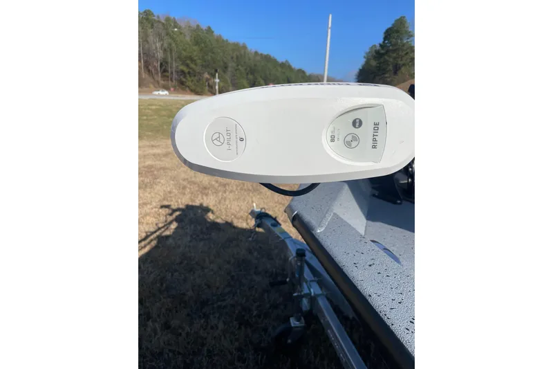 Slide: The Image of 2024 Express H22 boat with i-Pilot Riptide trolling motor in outdoor setting. - 11