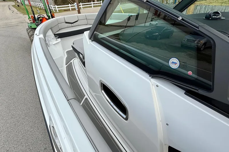 Slide: The Image of 2026 Monterey Elite 25 OB boat with sleek design and spacious seating. - 13