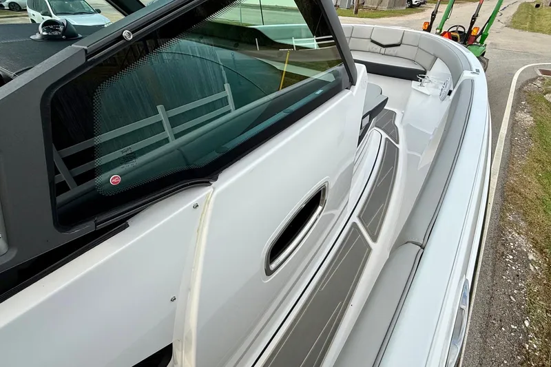 Slide: The Image of 2026 Monterey Elite 25 OB boat interior with sleek seating and modern design. - 15