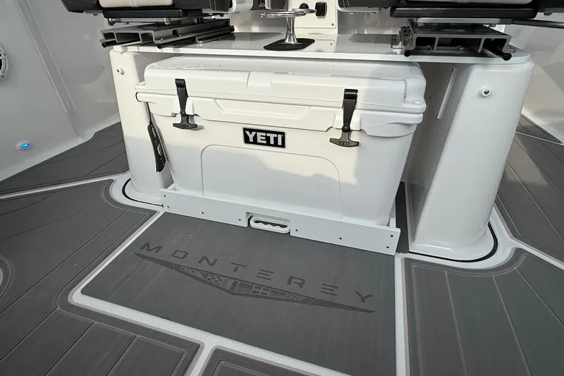 Slide: The Image of 2026 Monterey Elite 25 OB boat deck with Yeti cooler and seating. - 20