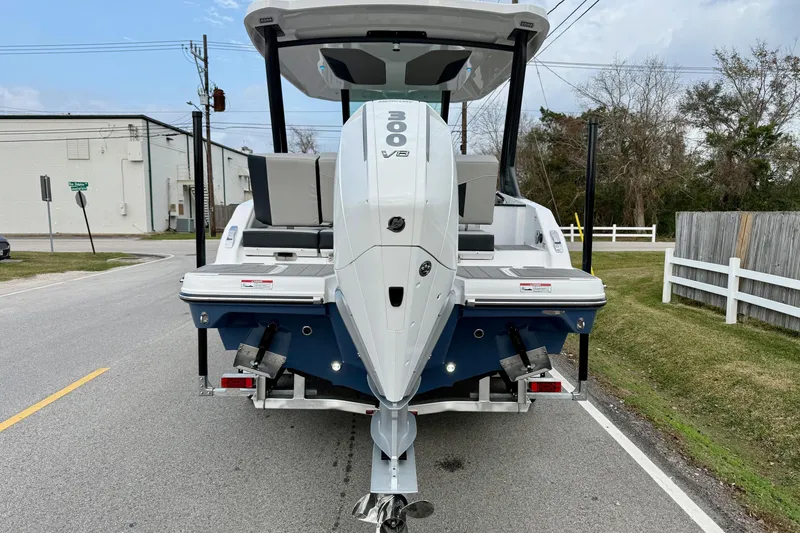 Slide: The Image of 2026 Monterey Elite 25 OB boat with powerful 300 V8 engine on a trailer. - 3