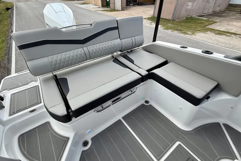Slide: The Image of 2026 Monterey Elite 25 OB boat interior with sleek seating and modern design. - 7