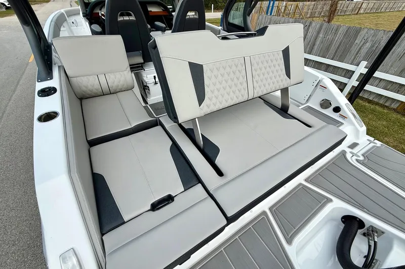 Slide: The Image of 2026 Monterey Elite 25 OB boat interior with stylish seating and modern design. - 8