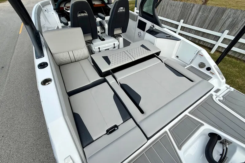Slide: The Image of 2026 Monterey Elite 25 OB boat interior with luxurious seating and modern design. - 9