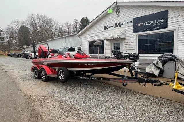 Slide: The Image of Red 2008 Ranger Z20 Comanche boat on trailer outside Knox Marine dealership. - 1