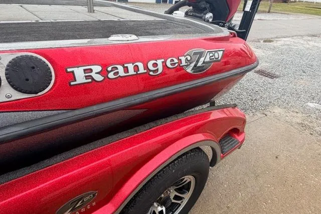Slide: The Image of Red 2008 Ranger Z20 Comanche boat on trailer, side view with logo visible. - 10