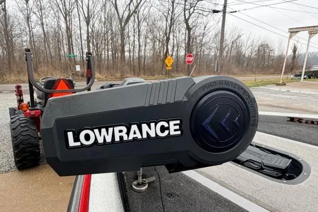 Slide: The Image of 2008 Ranger Z20 Comanche with Lowrance navigation system, parked near a wooded area. - 7